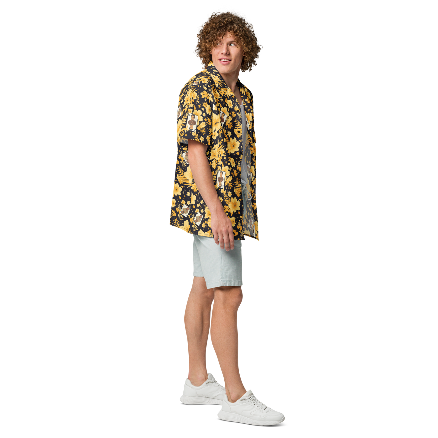 Michael Monday anarcho late night button shirt, right side view: a black hawaiian pattern of yellow hibiscus flowers, palm leaves and small Michael Monday portraits.