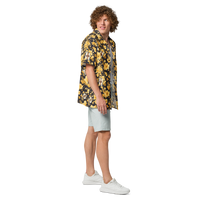 Michael Monday anarcho late night button shirt, right side view: a black hawaiian pattern of yellow hibiscus flowers, palm leaves and small Michael Monday portraits.