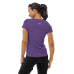 Back view of a woman wearing a purple nostr athletic shirt for women.