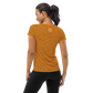 Back view of a woman wearing an orange bitcoin athletic shirt for women.