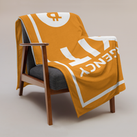 Emergency Exit Bitcoin throw blanket draped over a wooden armchair, showing the design across the full width of the blanket.
