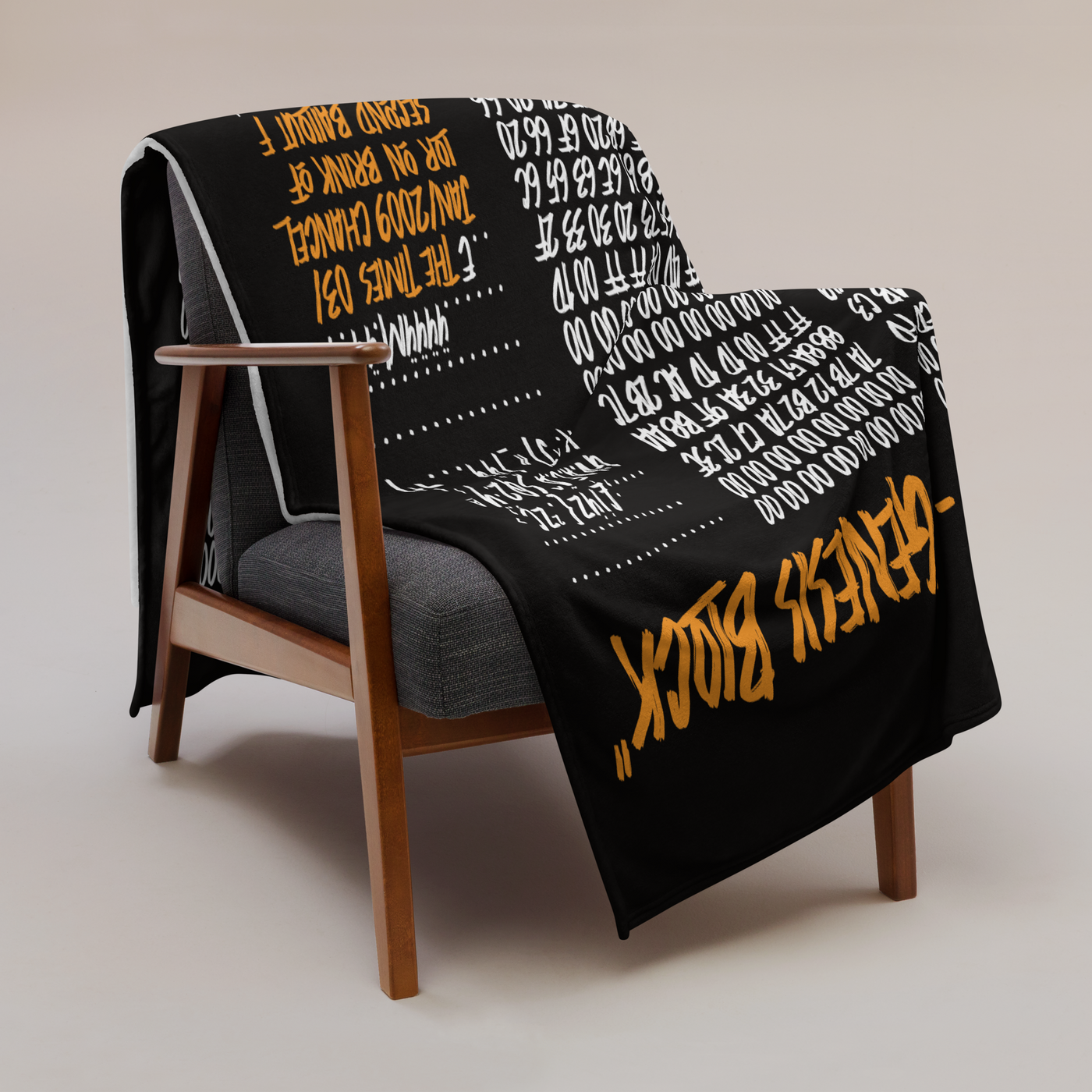 Genesis Block Bitcoin throw blanket draped over a wooden armchair, showing the design across the full width of the blanket.
