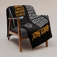 Genesis Block Bitcoin throw blanket draped over a wooden armchair, showing the design across the full width of the blanket.