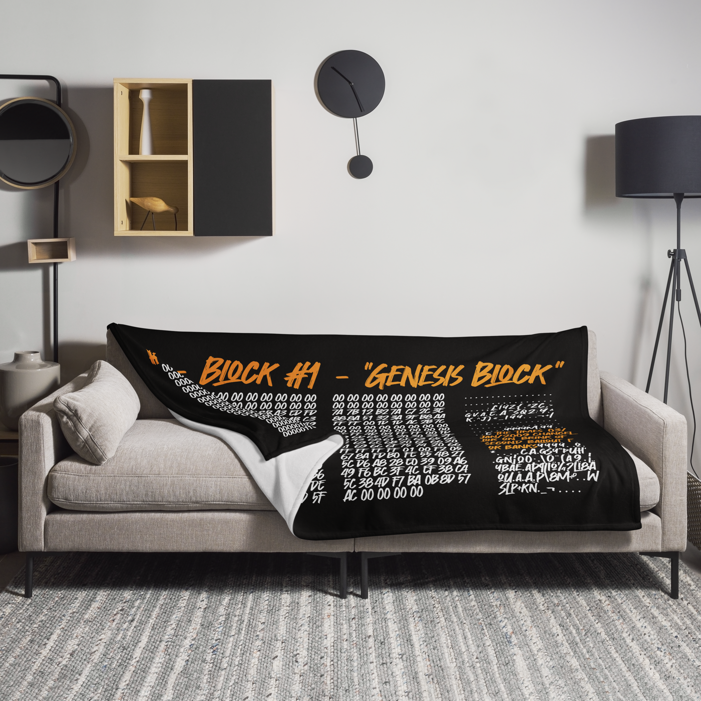 Genesis Block Bitcoin throw blanket spread across a light grey sofa in a living room, showing the design in a home setting.