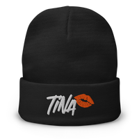 TINA embroidered bitcoin beanie, front view: TINA embroidered in white brush lettering beside an orange lipstick kiss, on a cuffed beanie.
