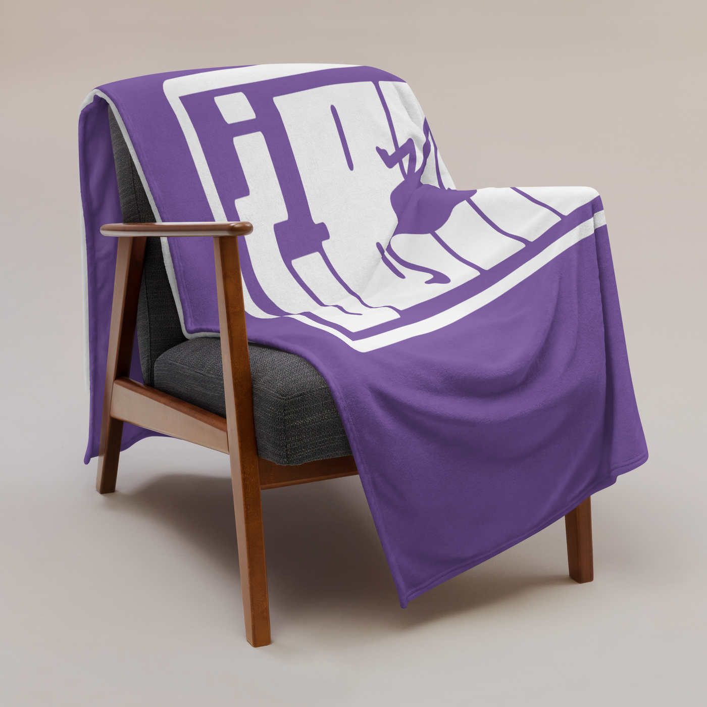 nPub? Nostr throw blanket draped over a wooden armchair, showing the design across the full width of the blanket.