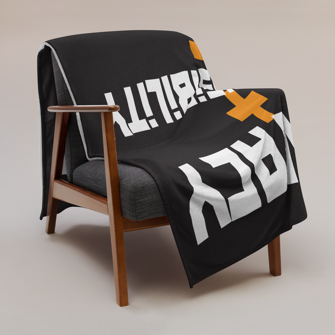 Privacy + Responsibility = Freedom Bitcoin throw blanket draped over a wooden armchair, showing the design across the full width of the blanket.