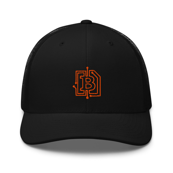Circuit Board bitcoin trucker cap, front view: a black trucker cap with mesh side panels and an orange bitcoin B embroidered as a circuit-board trace.