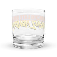 Michael Monday Anarcho Late Night rocks glass, clear 10.5 oz whiskey glass with a band running all the way around: ANARCHO LATE NIGHT in orange on grey above the name Michael Monday in yellow brush script, back view, the band showing through the glass in mirror image.