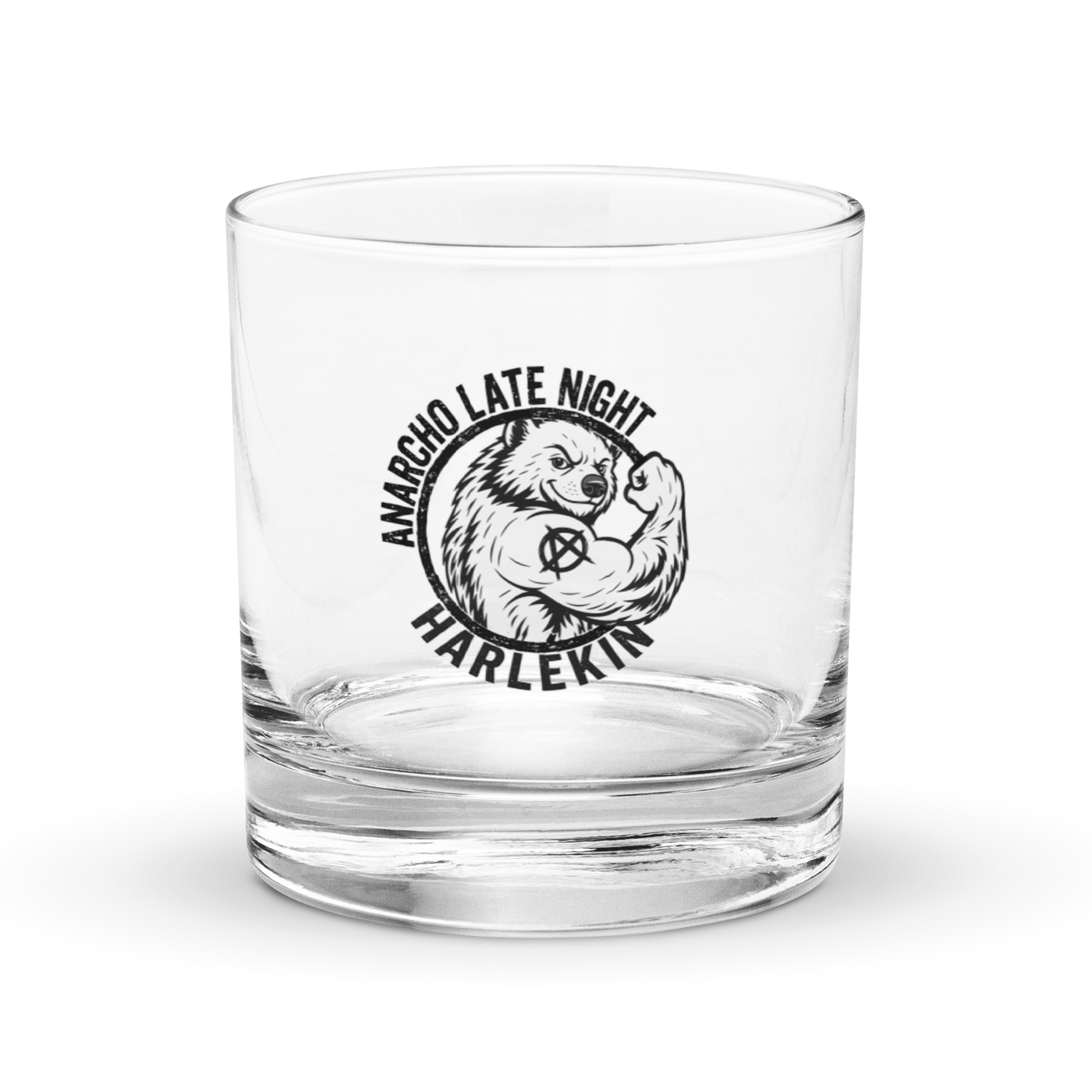 Anarcho Late Night Logo Rocks glass anarcho late night logo rocks glass, front view: a clear rocks glass carrying the circular ANARCHO LATE NIGHT HARLEKIN badge in black, a flexing bear with an anarchy symbol.
