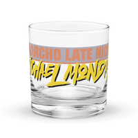 Michael Monday Anarcho Late Night rocks glass, clear 10.5 oz whiskey glass with a band running all the way around: ANARCHO LATE NIGHT in orange on grey above the name Michael Monday in yellow brush script, front view.