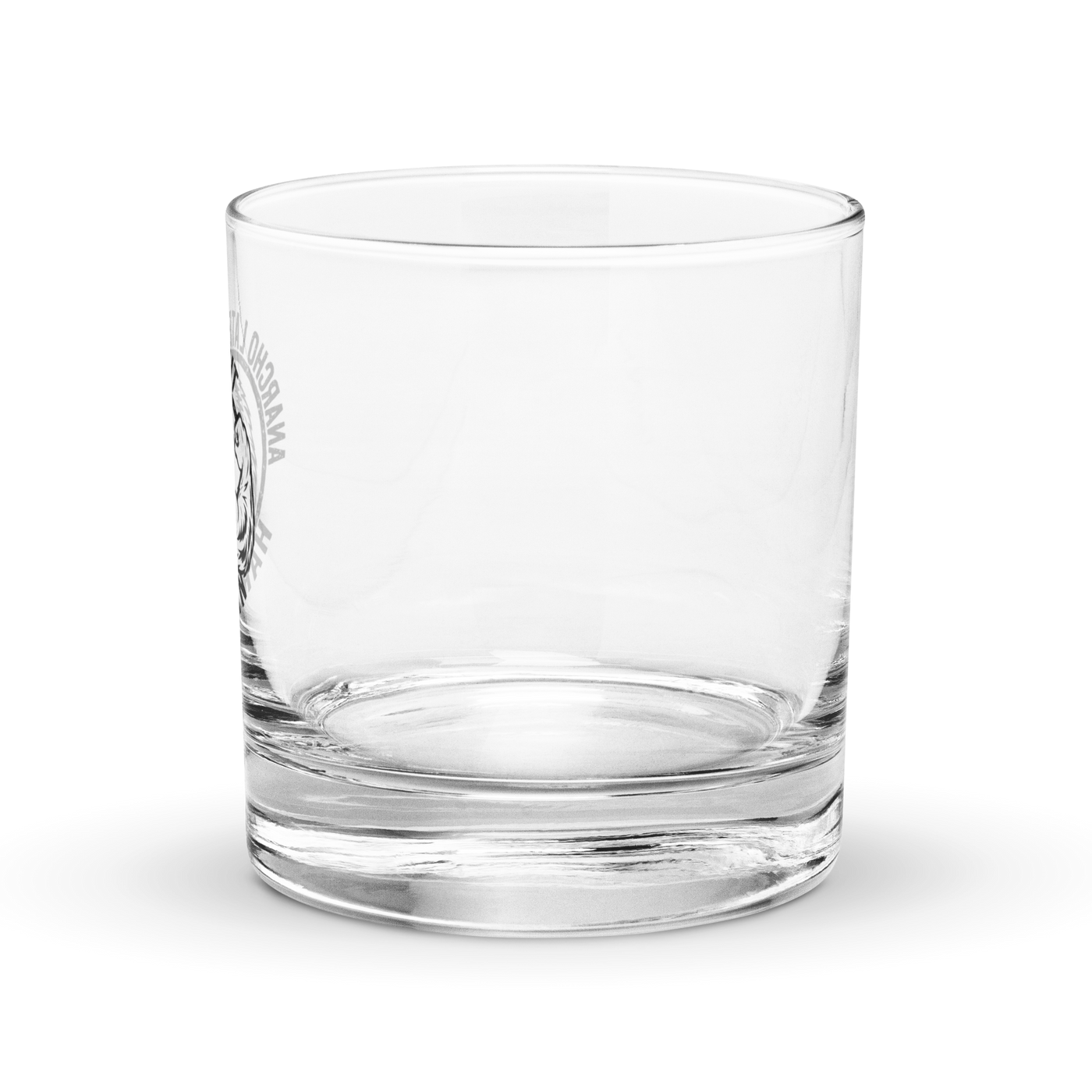 Anarcho Late Night Harlekin rocks glass, clear 10.5 oz whiskey glass with a round badge showing a grinning bear flexing its arm, an anarchy A on the biceps, the words ANARCHO LATE NIGHT arched above and HARLEKIN below, left side view with the badge at the left edge.