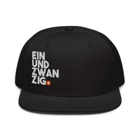 Einundzwanzig bitcoin snapback hat, front view: a black snapback with a flat brim, EIN UND ZWAN ZIG embroidered in white block letters across four lines with a small orange bitcoin coin.