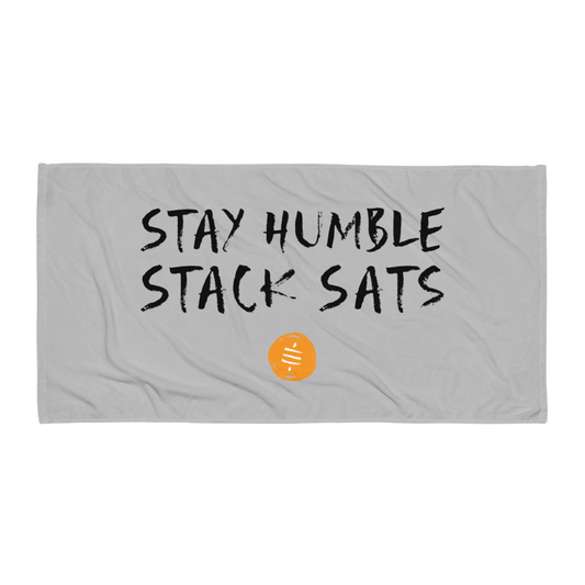Front view of a silver stay humble stack sats bitcoin towel.