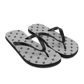 Side view of a pair of silver and black bitcoin flip flops.