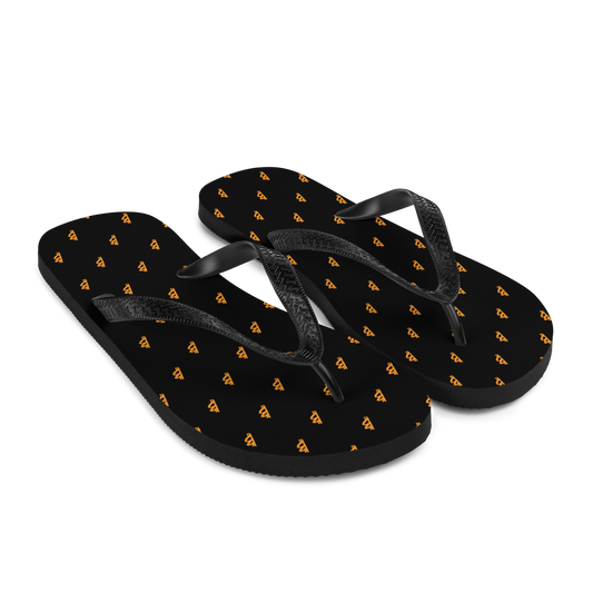 Side view of a pair of black bitcoin flip flops.