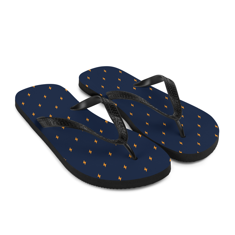 Side view of a pair of navy blue and black bitcoin flip flops.