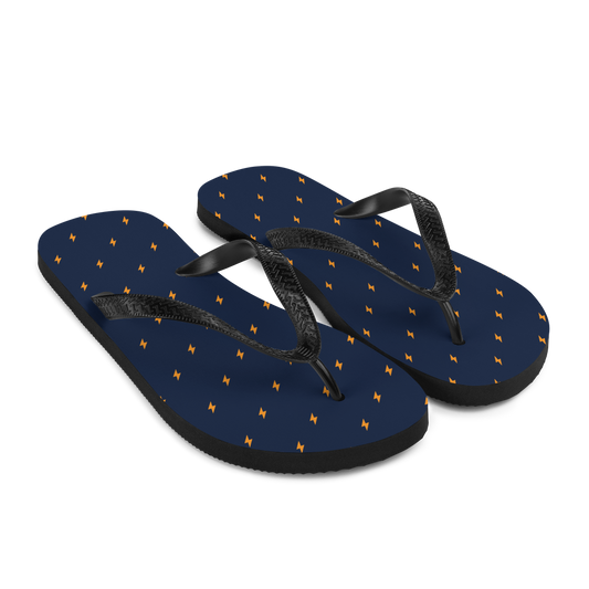 Side view of a pair of navy blue and black bitcoin flip flops.