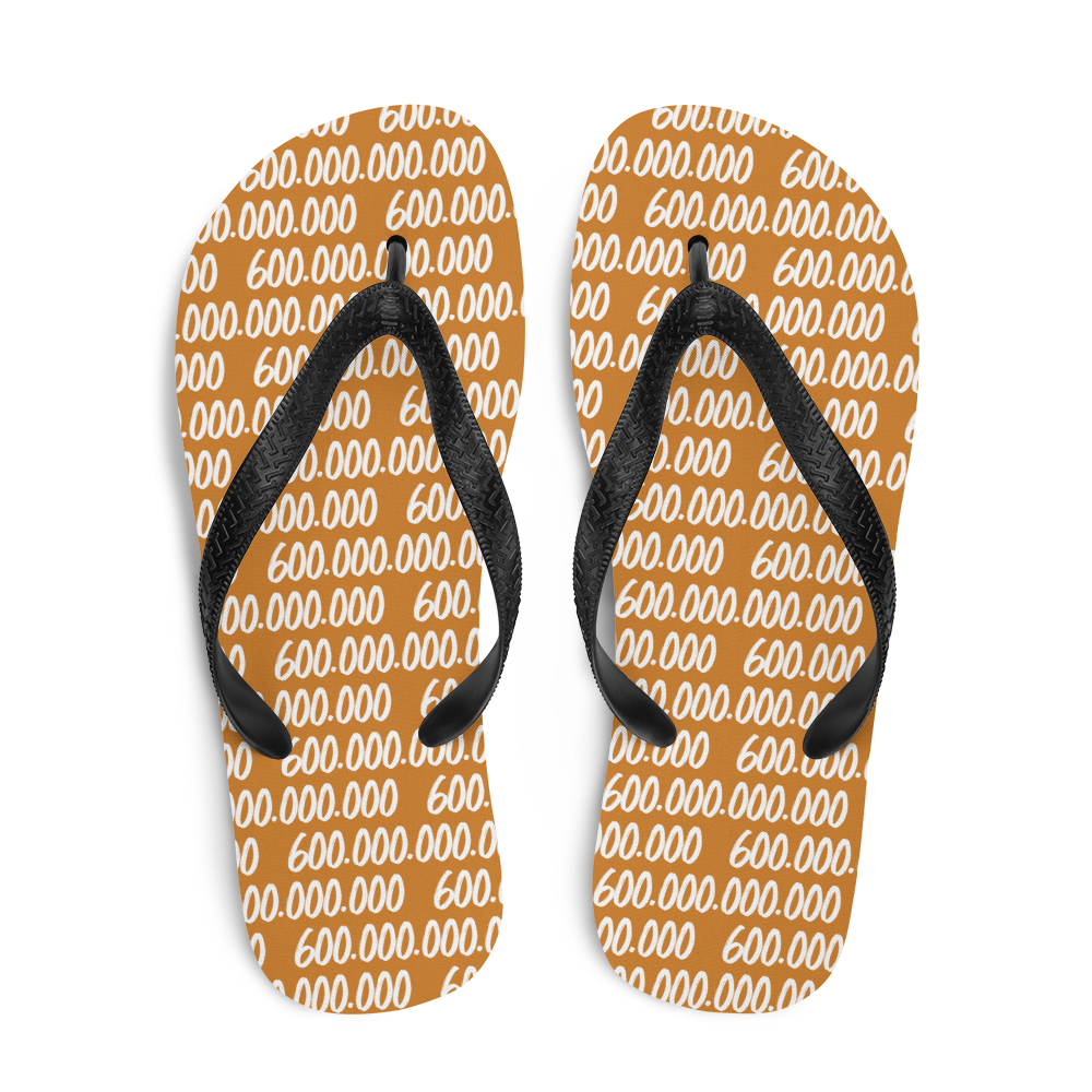 Top view of a pair of orange and black bitcoin flip flops.