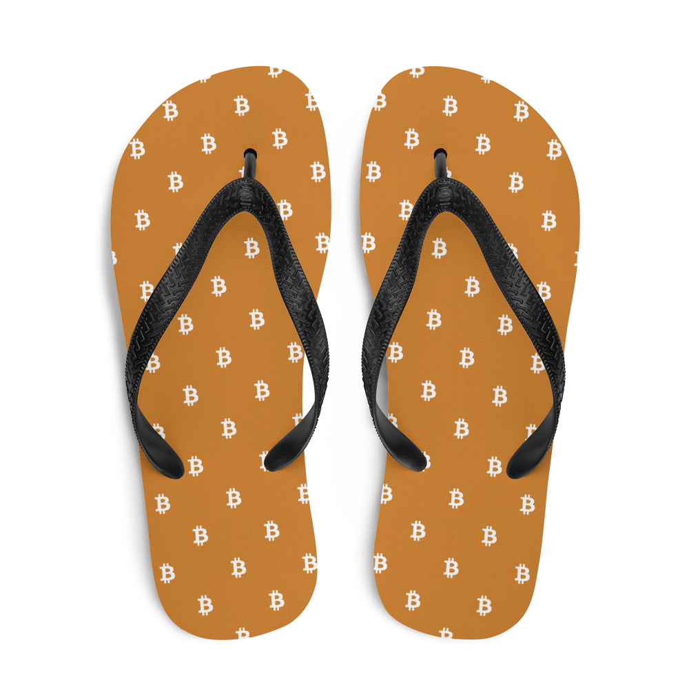 Top view of a pair of orange and black bitcoin flip flops.