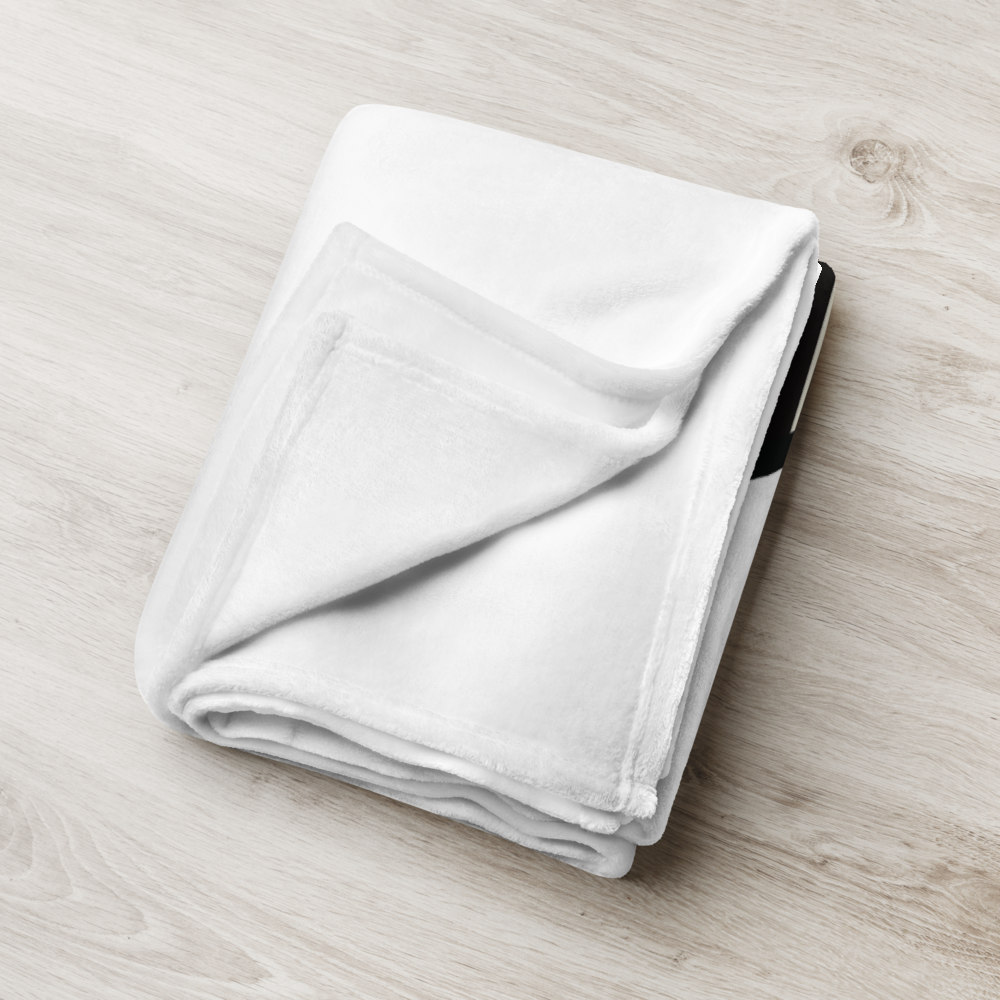 Detailed view of the folded white bitcoin blanket.