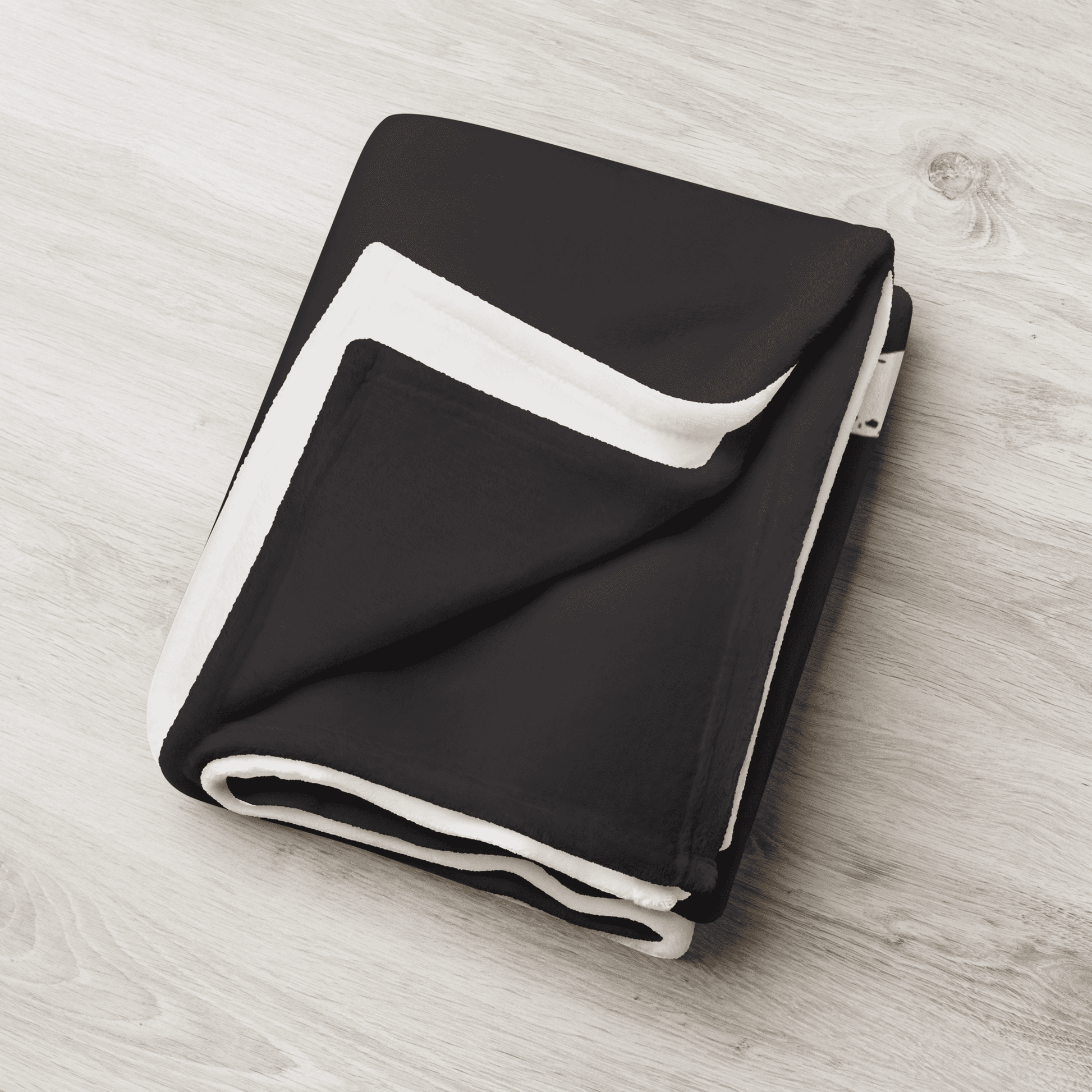 Detailed view of the folded black bitcoin blanket.