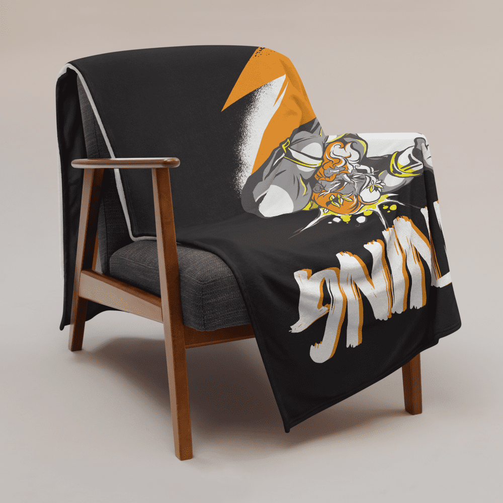 View of a sofa with a black bitcoin blanket.