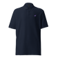 Front view of a navy blue embroidered nostr polo shirt.