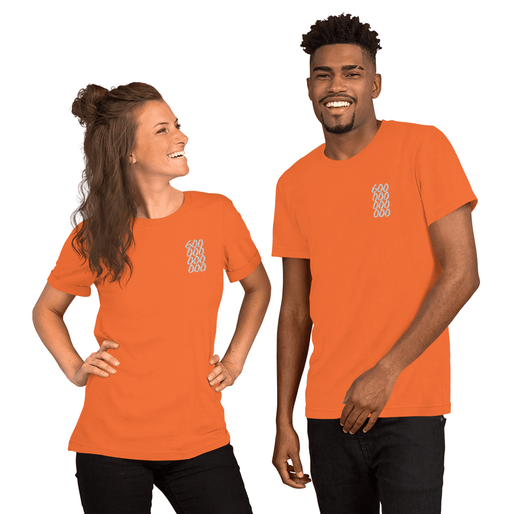 A couple wearing orange bitcoin shirts.