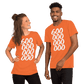 A couple wearing orange bitcoin shirts.