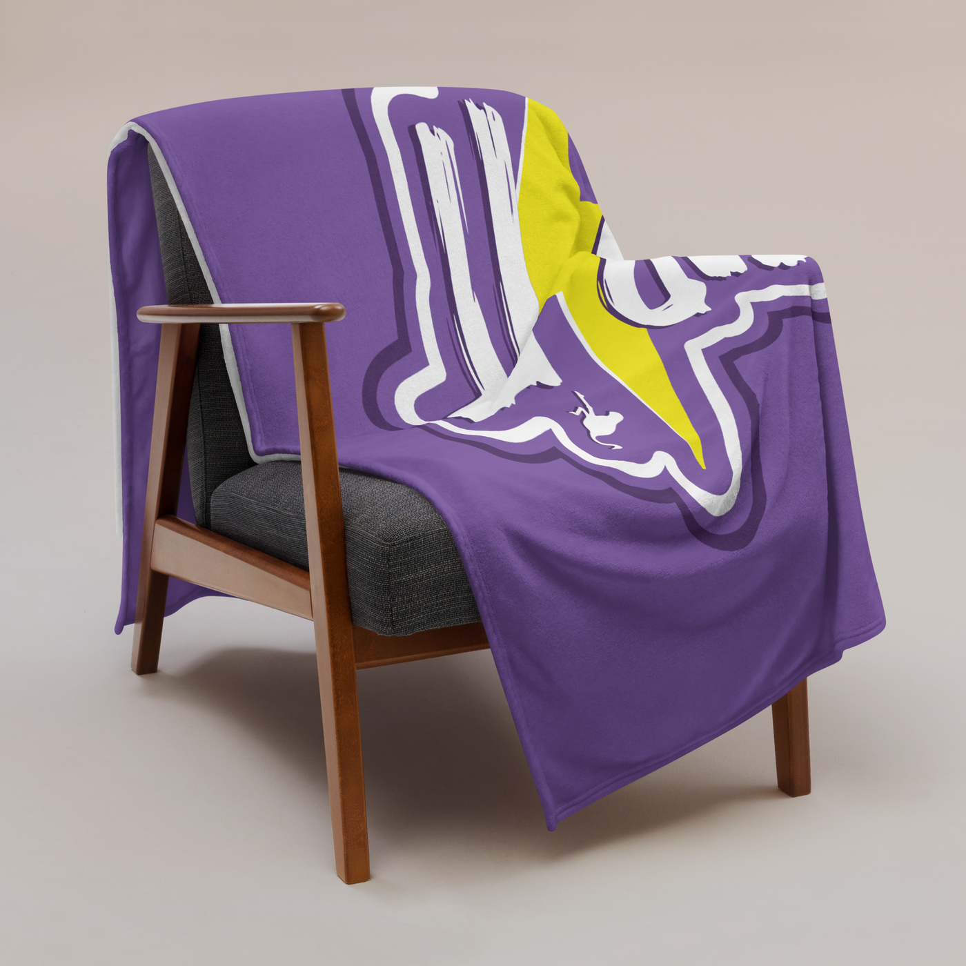 Zap It Nostr throw blanket draped over a wooden armchair, showing the design across the full width of the blanket.