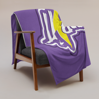 Zap It Nostr throw blanket draped over a wooden armchair, showing the design across the full width of the blanket.